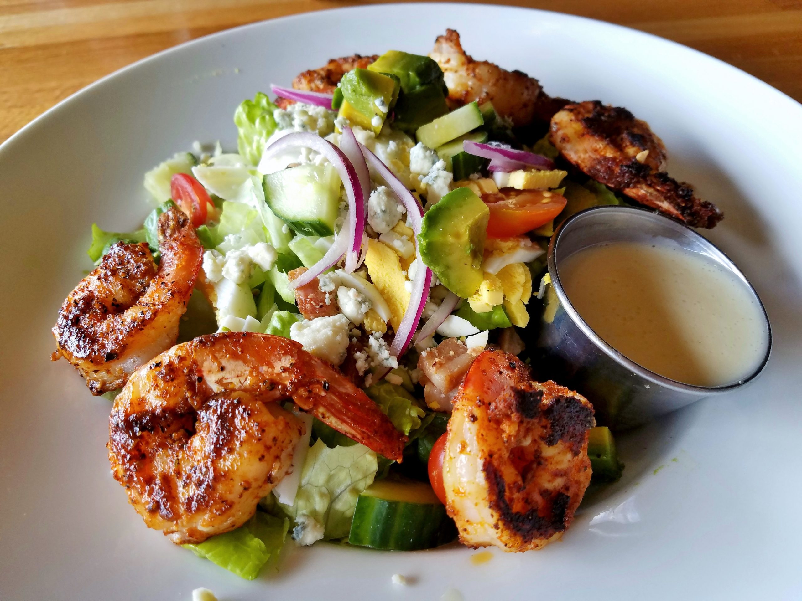 Veggies and shrimp on an angled top view; healthy food choices, dieting, salad ideas